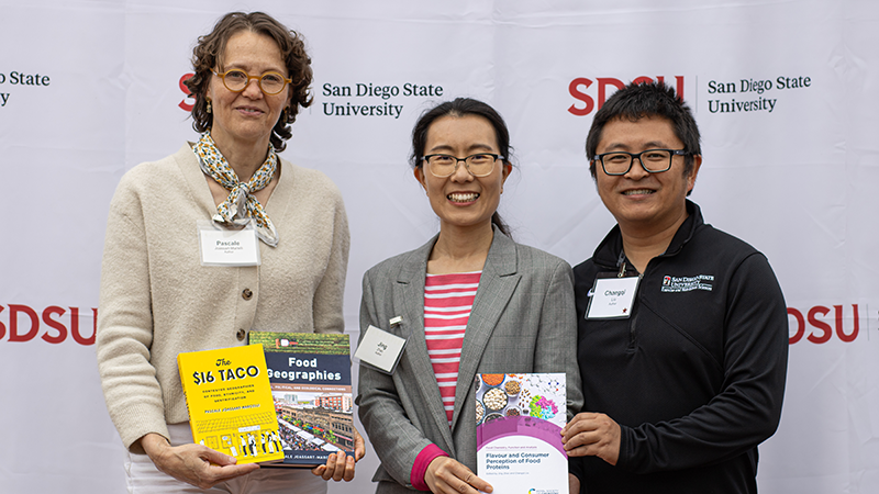 Book authors holding up books about food