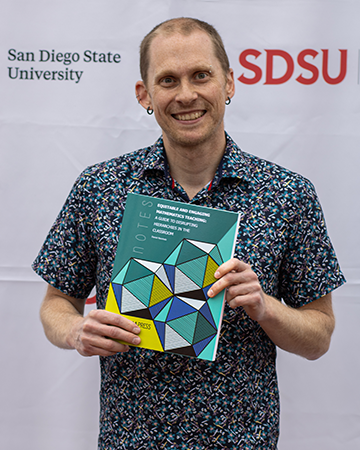 Daniel Reinholz with book