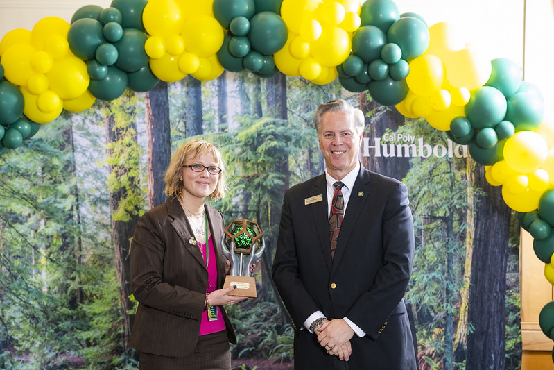 Lila Zeichner holding her award at the CSU Research Competition