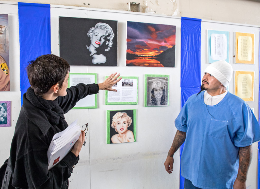 Annie Buckley guides a participant during one of Prison Art Collective’s critique classes at the California Institution for Men. 